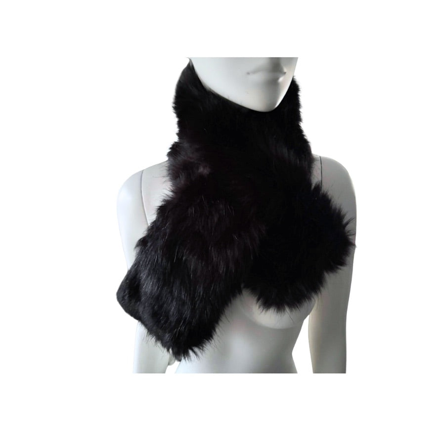 Black fur scarf on a mannequin against a white background
