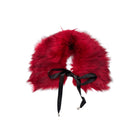 Red furry collar with a black ribbon on a white background