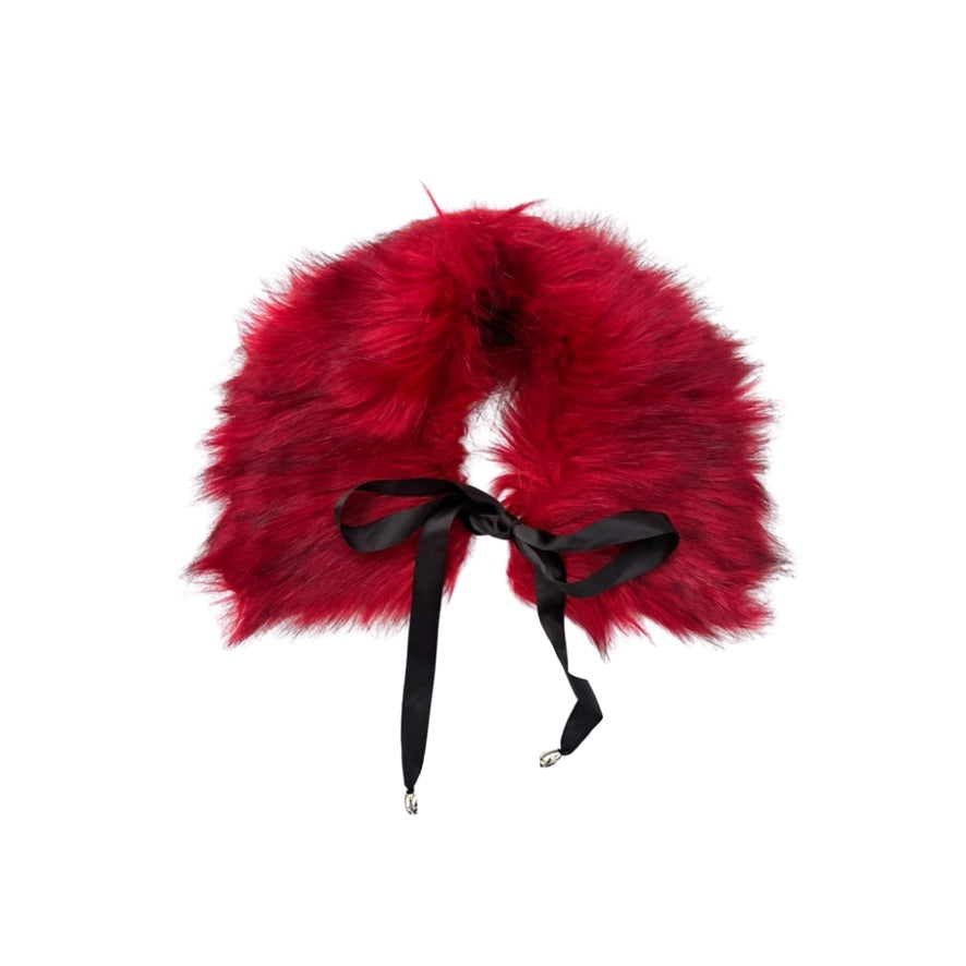 Red furry collar with a black ribbon on a white background