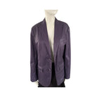 Purple blazer on a mannequin against a white background