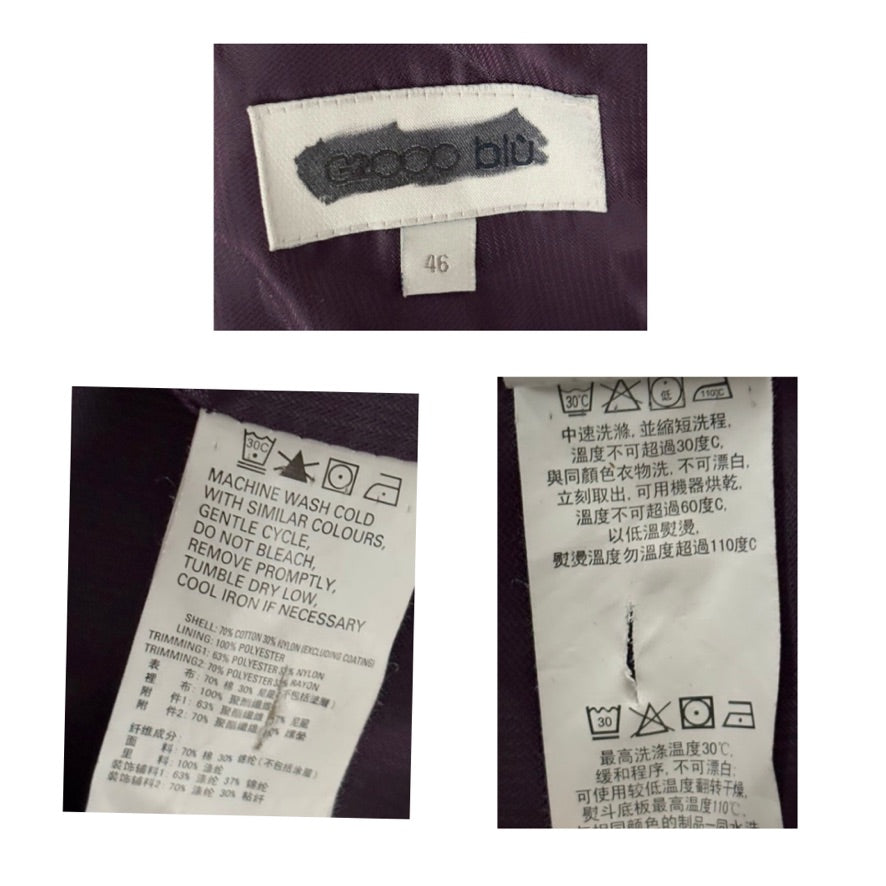 Clothing labels with brand name and care instructions on a white background