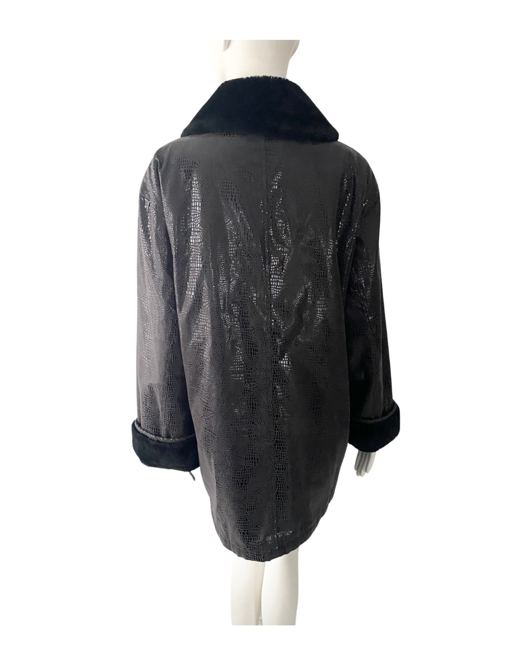Black leather jacket on a mannequin against a white background