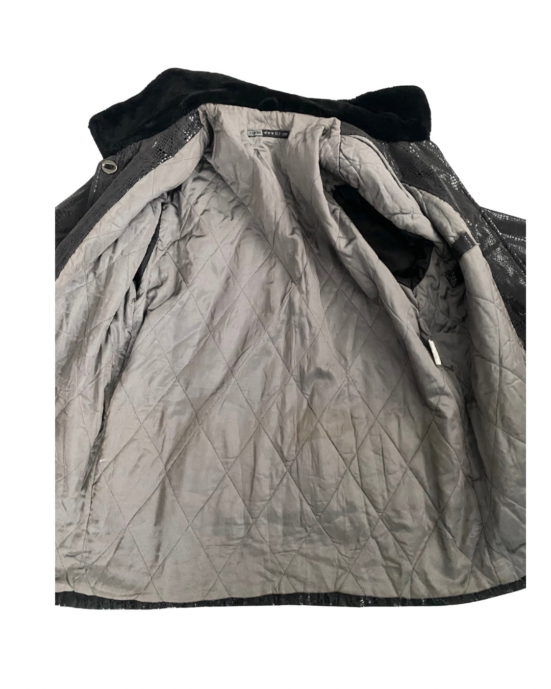 Quilted jacket with black trim on a white background