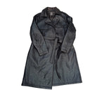 Black quilted coat with a belt on a white background