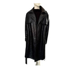 Black textured coat on a mannequin against a white background