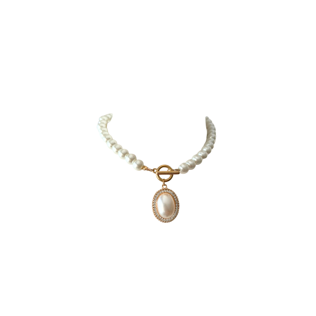 Pearl necklace with a gold clasp on a white background