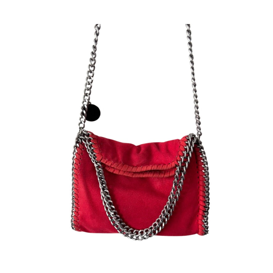 Red handbag with silver chain strap on a white background