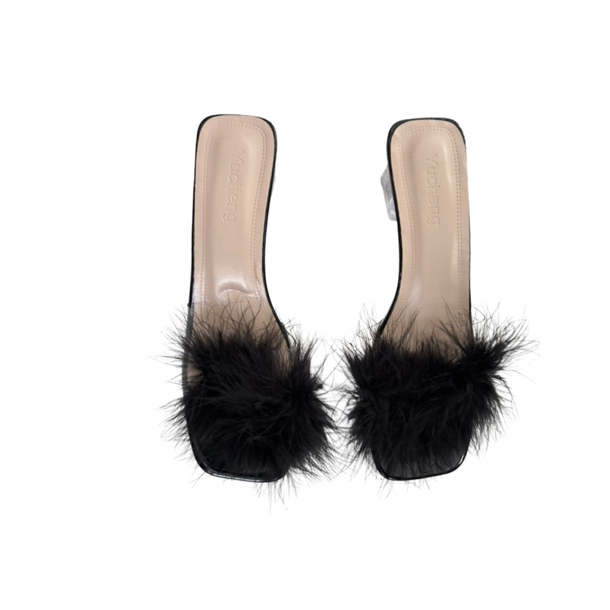 Black feather sandals on a white background