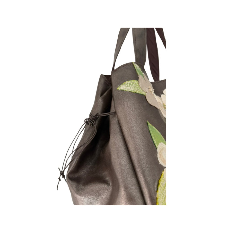 Floral-patterned bag with a drawstring on a white background