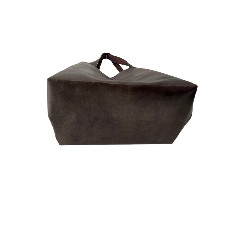 Brown leather bag on a white background