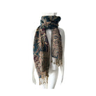 Patterned scarf on a mannequin against a white background