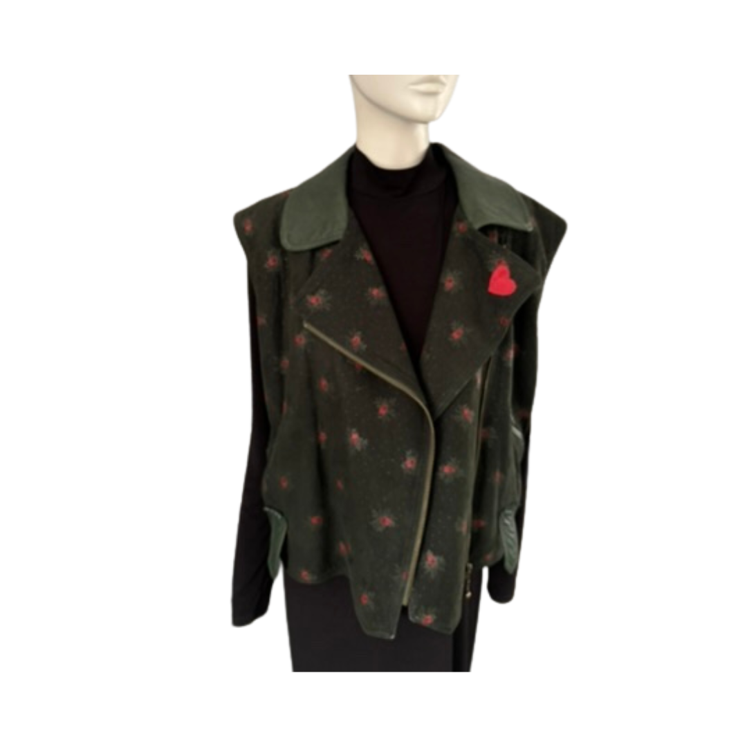 Green patterned vest with a red heart on a mannequin against a white background