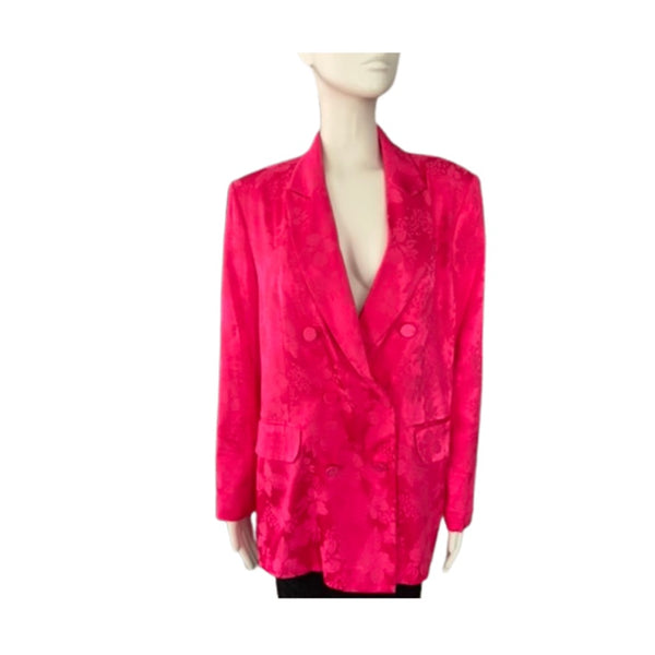 Mannequin wearing a bright pink blazer on a white background