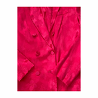 Close-up of a bright pink textured fabric with buttons on a white background