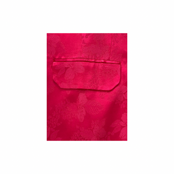 Pink floral patterned fabric with a pocket on a white background