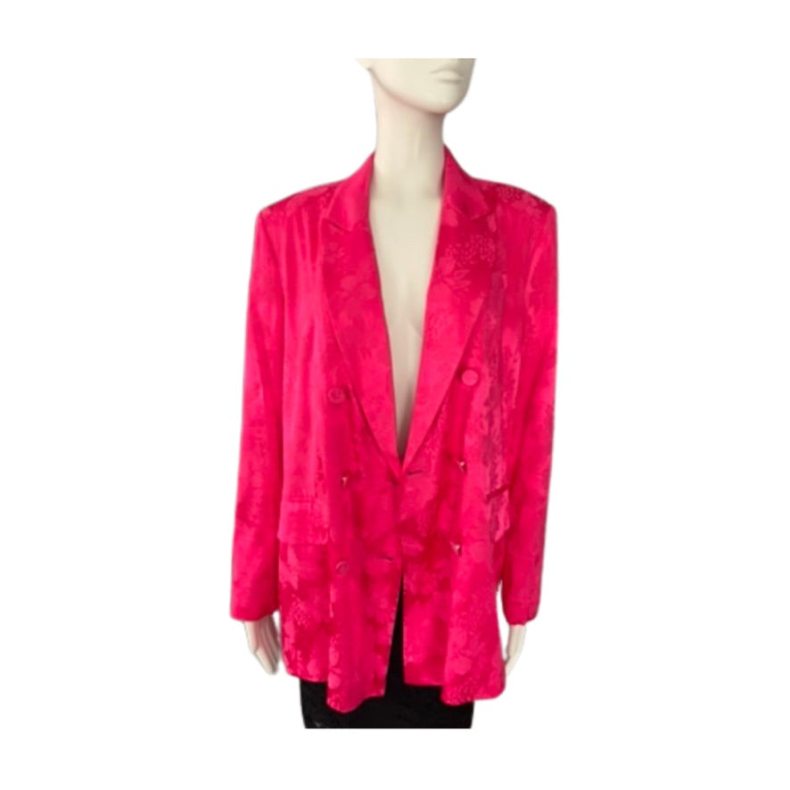 Mannequin wearing a bright pink blazer on a white background