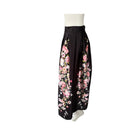 Black skirt with pink floral pattern on a white background