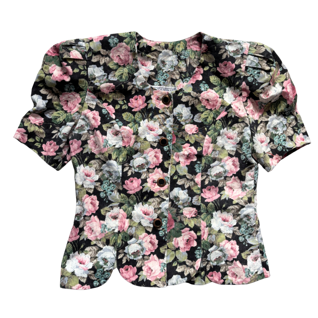 Vintage Jessica Howard floral blouse with black multicolour rose print and gold-rimmed buttons.