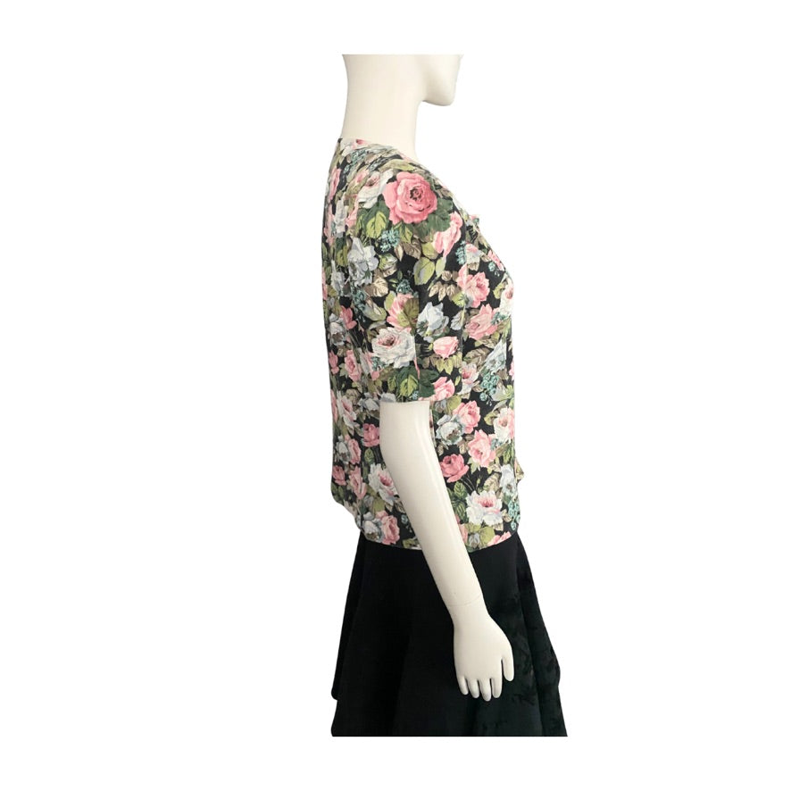 Mannequin wearing a floral blouse with a white background