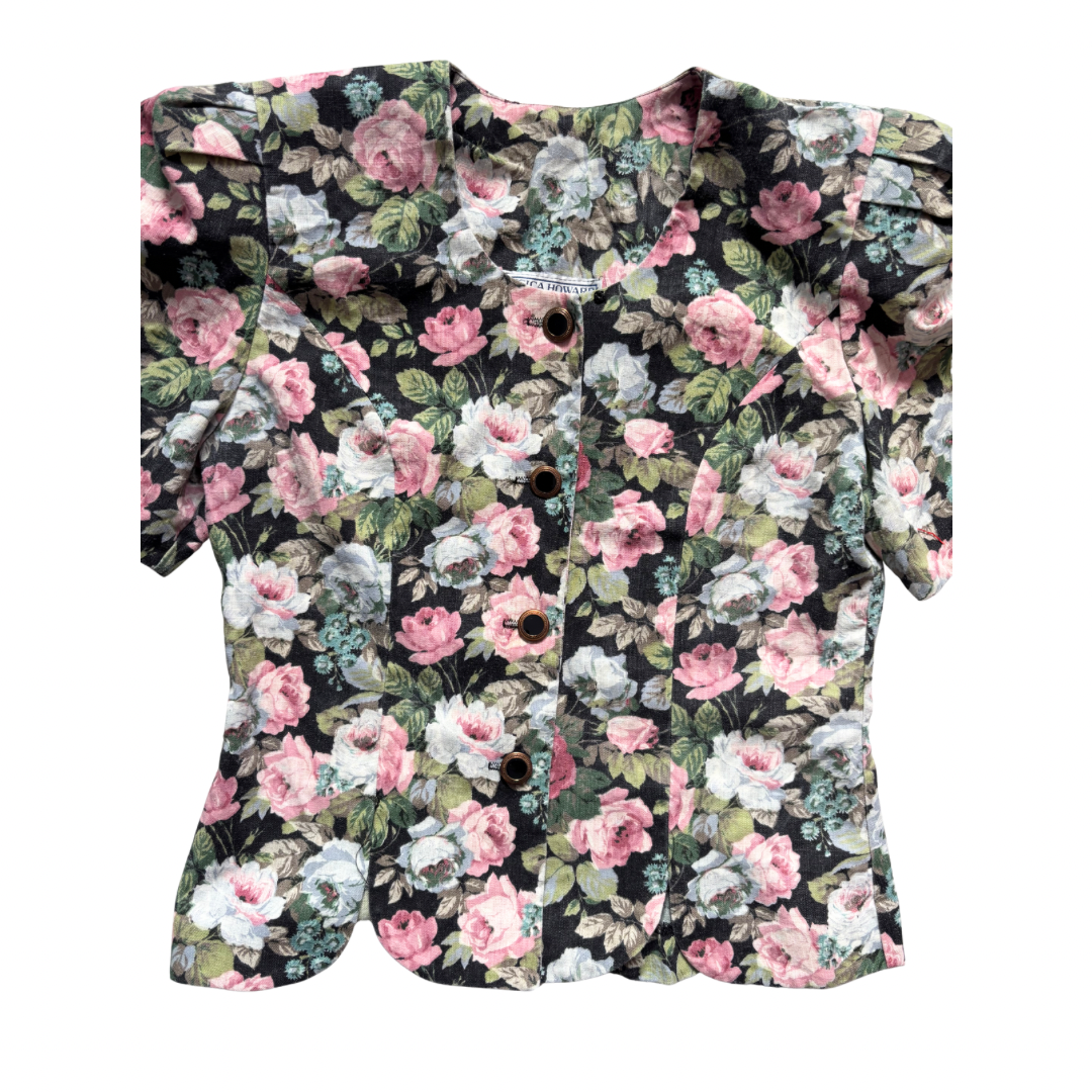 Floral-patterned button top on a white background