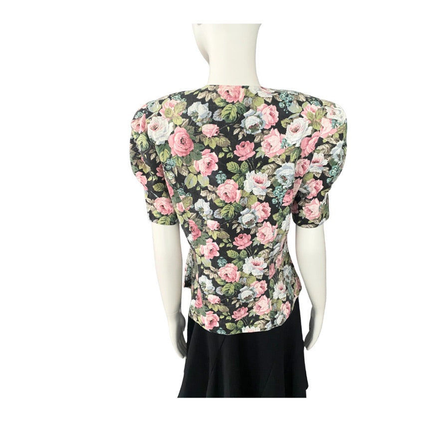 Floral blouse on a mannequin with a white background