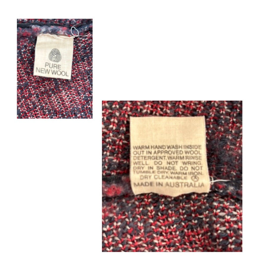Textile label on a patterned fabric with care instructions and material information.