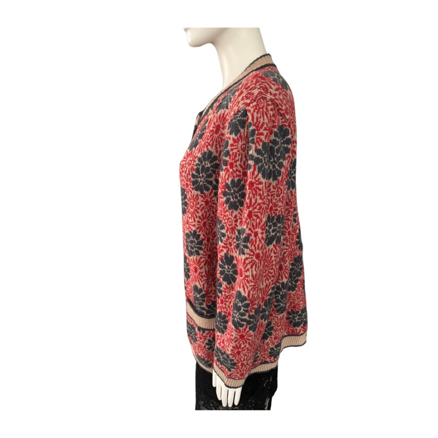 Red and black floral patterned dress on a mannequin against a white background