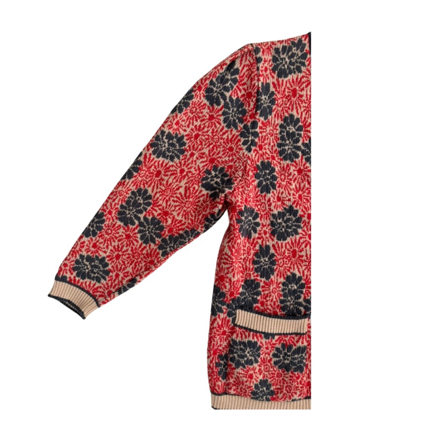 Red and black floral patterned scarf on a white background