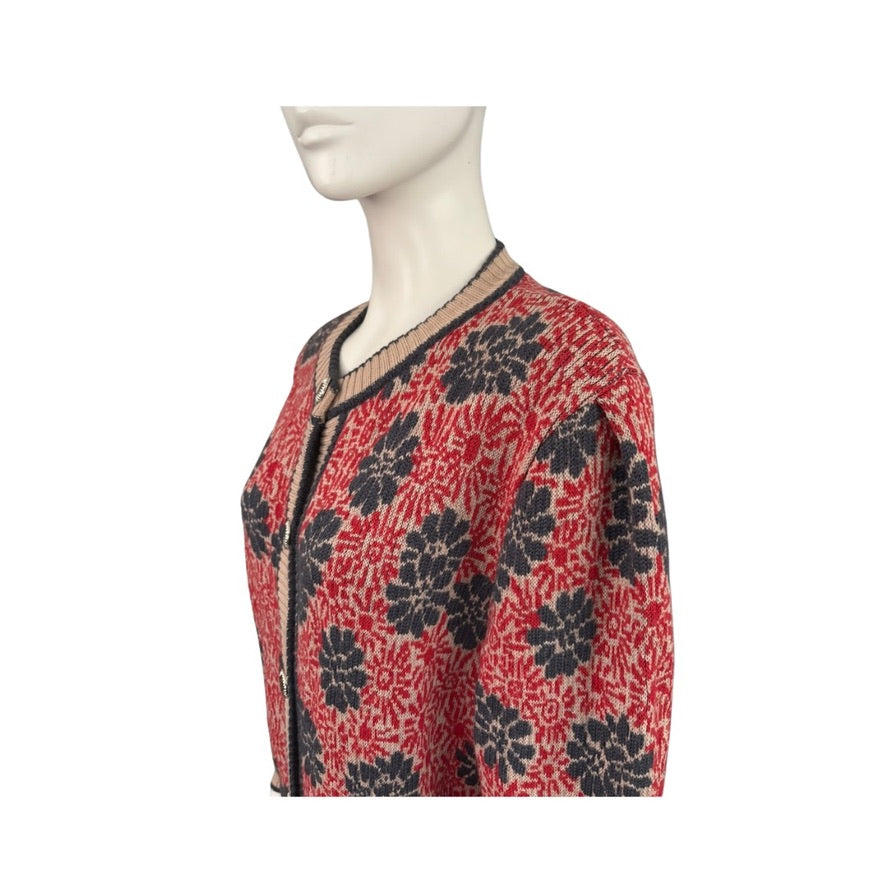 Red and navy floral patterned top on a mannequin against a white background