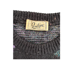 Close-up of a textured fabric with a 'Boutique' label on a white background