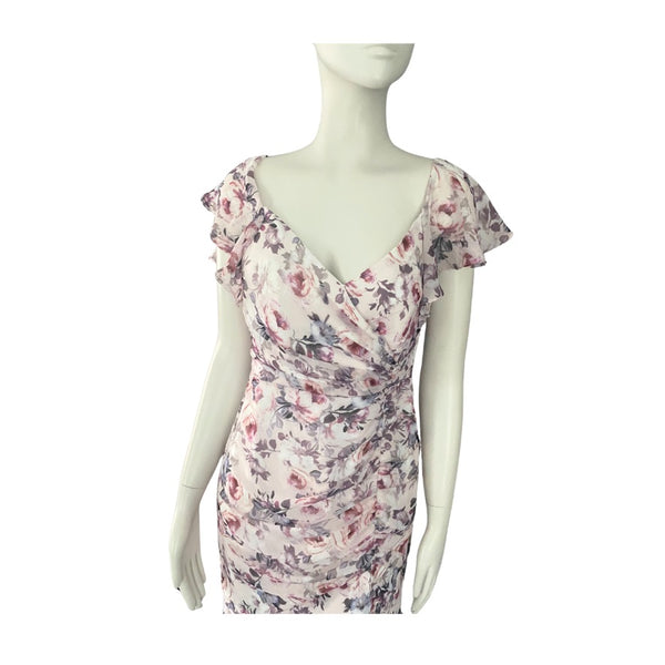 Floral dress on a mannequin against a white background