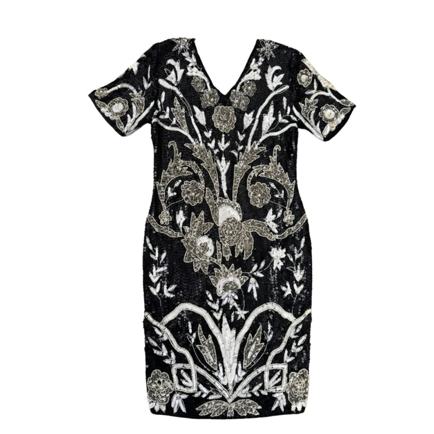 Black dress with silver floral embroidery on a white background
