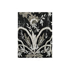 Decorative black fabric with silver floral patterns on a white background