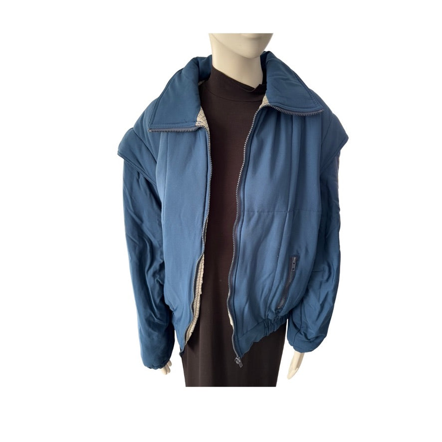 Blue jacket on a mannequin against a white background