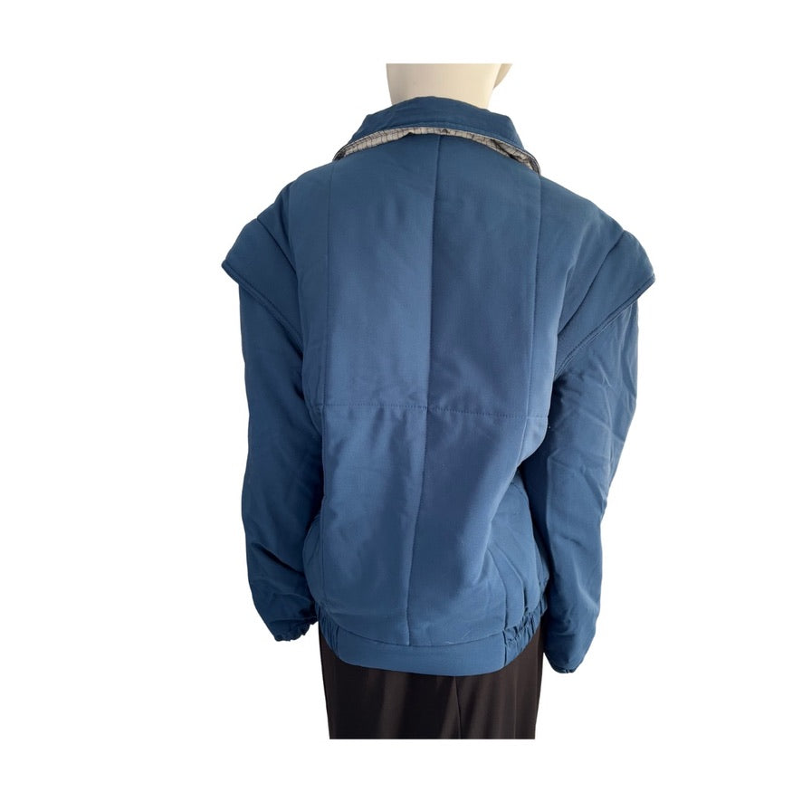 Blue jacket on a mannequin against a white background
