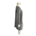 Black and white checkered skirt on a mannequin against a white background