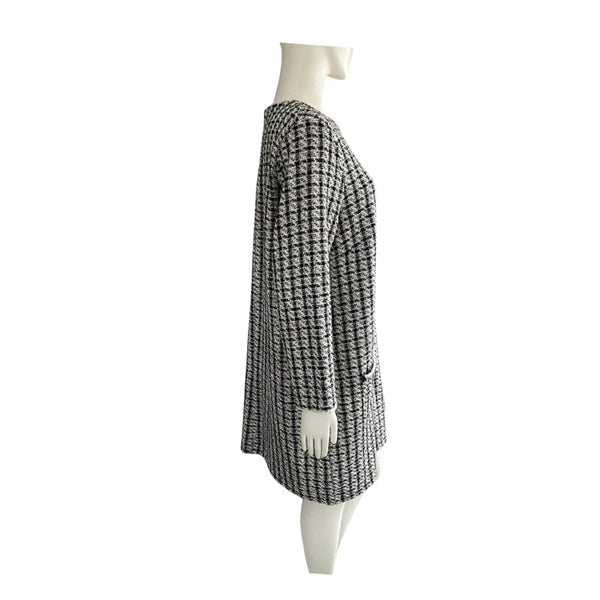 Black and white checkered skirt on a mannequin against a white background
