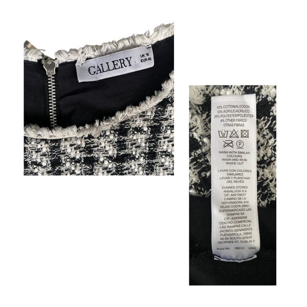 Close-up of a garment with 'GALLERY' label and fabric composition label on a white background