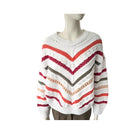 Striped sweater on a mannequin against a white background