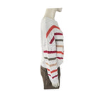 Mannequin wearing a colorful striped sweater on a white background
