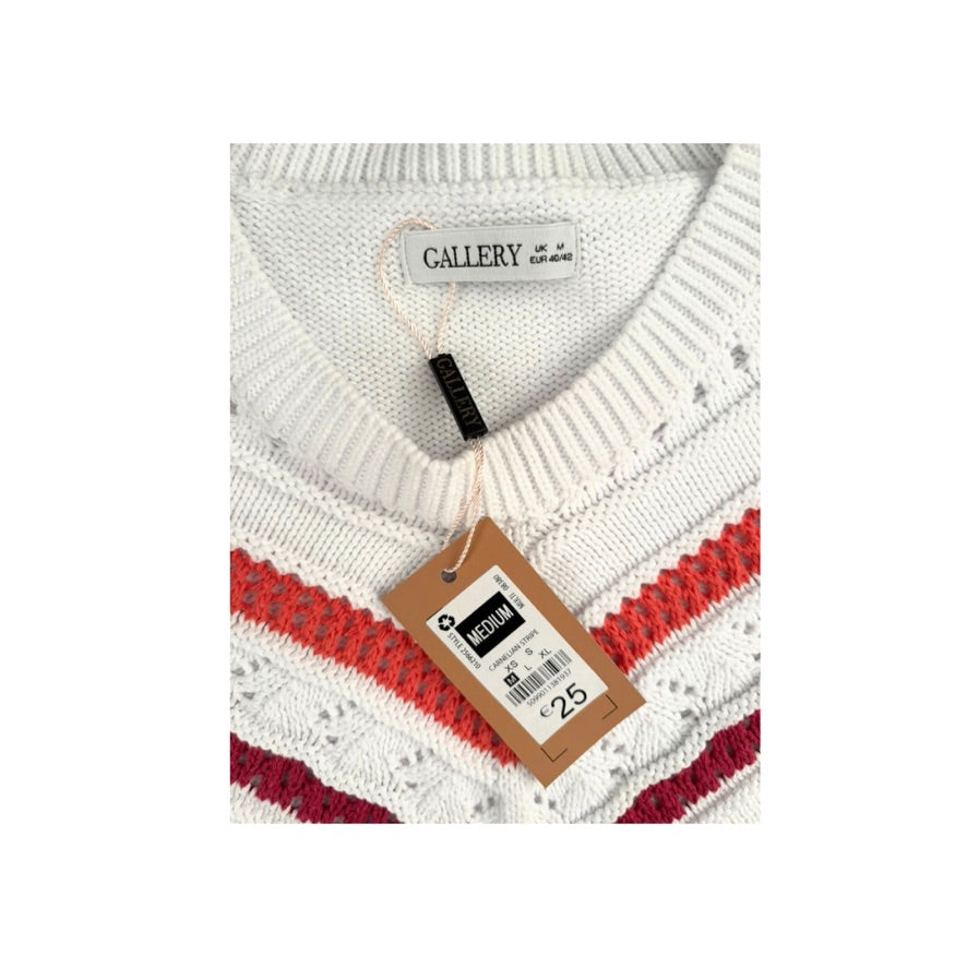 White sweater with red and gray stripes and a visible tag on a white background
