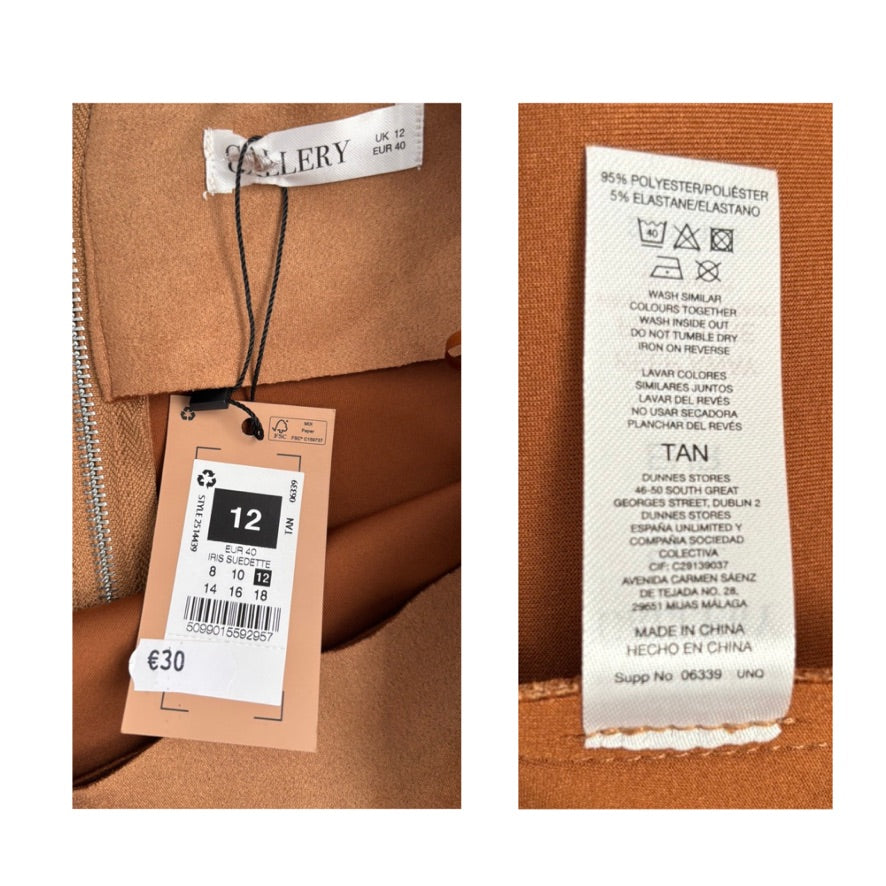 Close-up of clothing tags on a brown fabric background