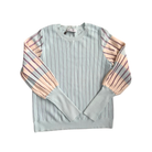 Light blue sweater with striped sleeves on a white background