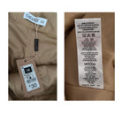 Clothing tags on a brown fabric background