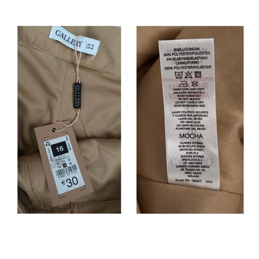 Clothing tags on a brown fabric background