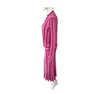 Mannequin wearing a pink striped outfit on a white background