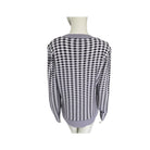 Black and white checkered shirt on a mannequin against a white background