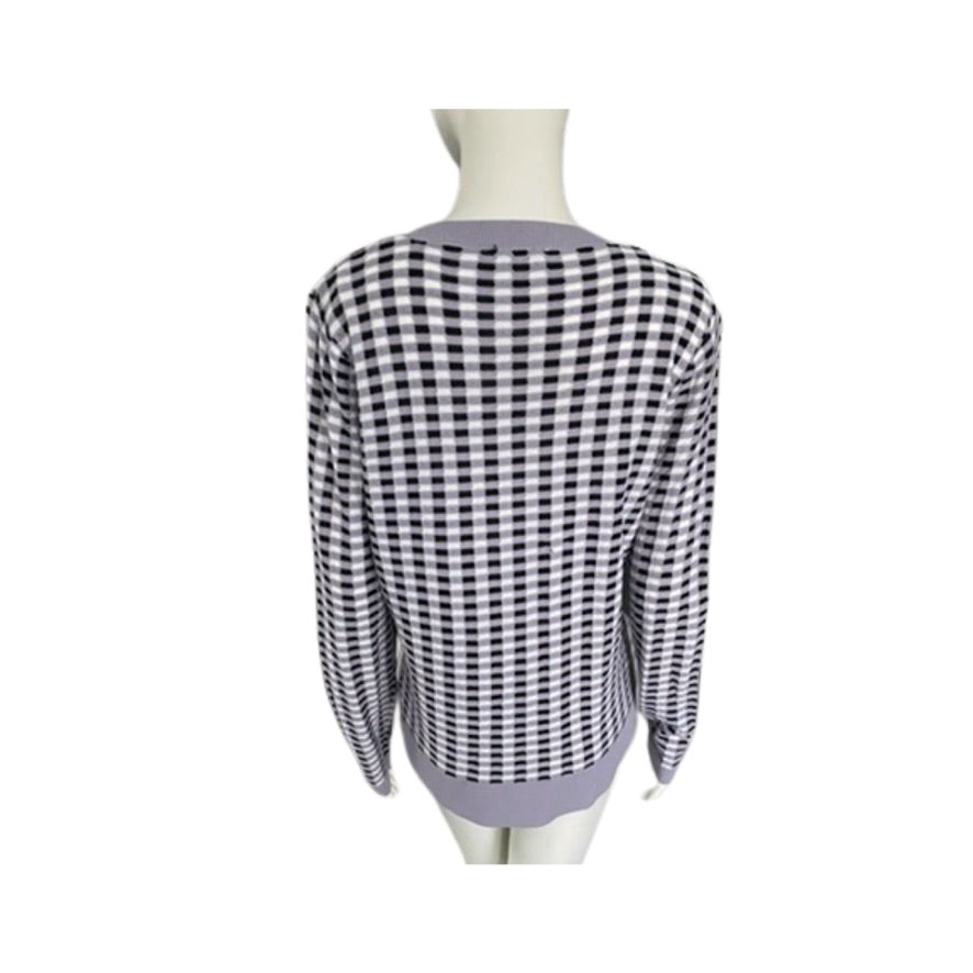Black and white checkered shirt on a mannequin against a white background