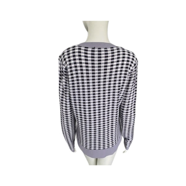 Black and white checkered shirt on a mannequin against a white background