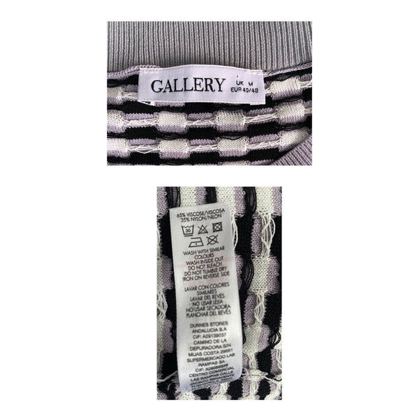 Close-up of a patterned garment with 'Gallery' label and care instructions on a white background